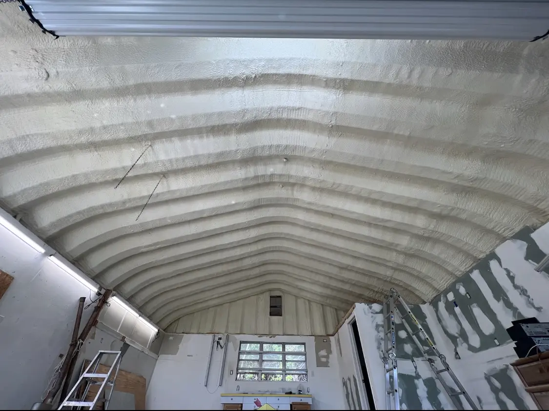 Spray polyurethane foam applied to the underside of a metal roof deck in Rossville